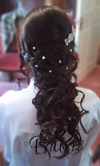 Curled and plaited down do wedding hair