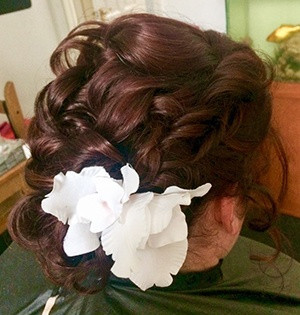 bridal hair up style with large flower